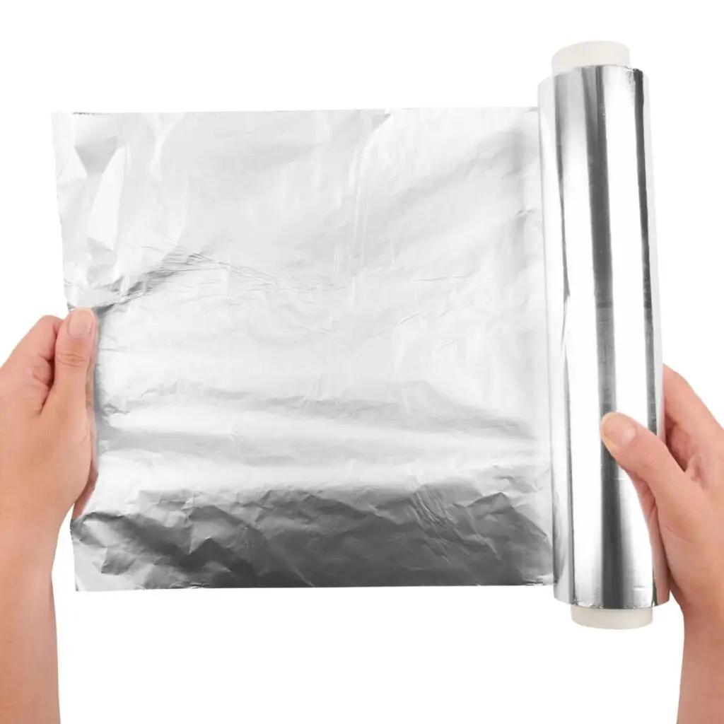 holding an aluminum foil